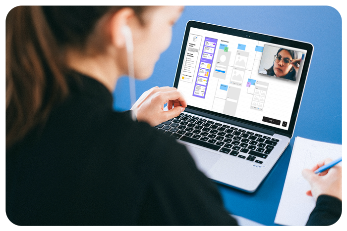 Bring Your Own User - Woman taking note in front of macbook.