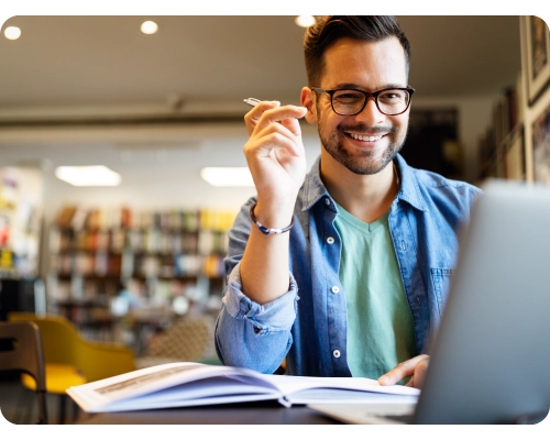 User researcher smiling and learning from Userlytics whitepapers, 